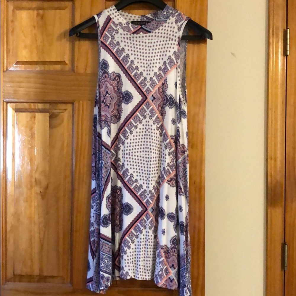 Super cute no sleeve dress. Size medium.